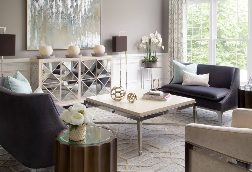 Stylish living room decorated with contemporary furniture, abstract art, and decorative accents.