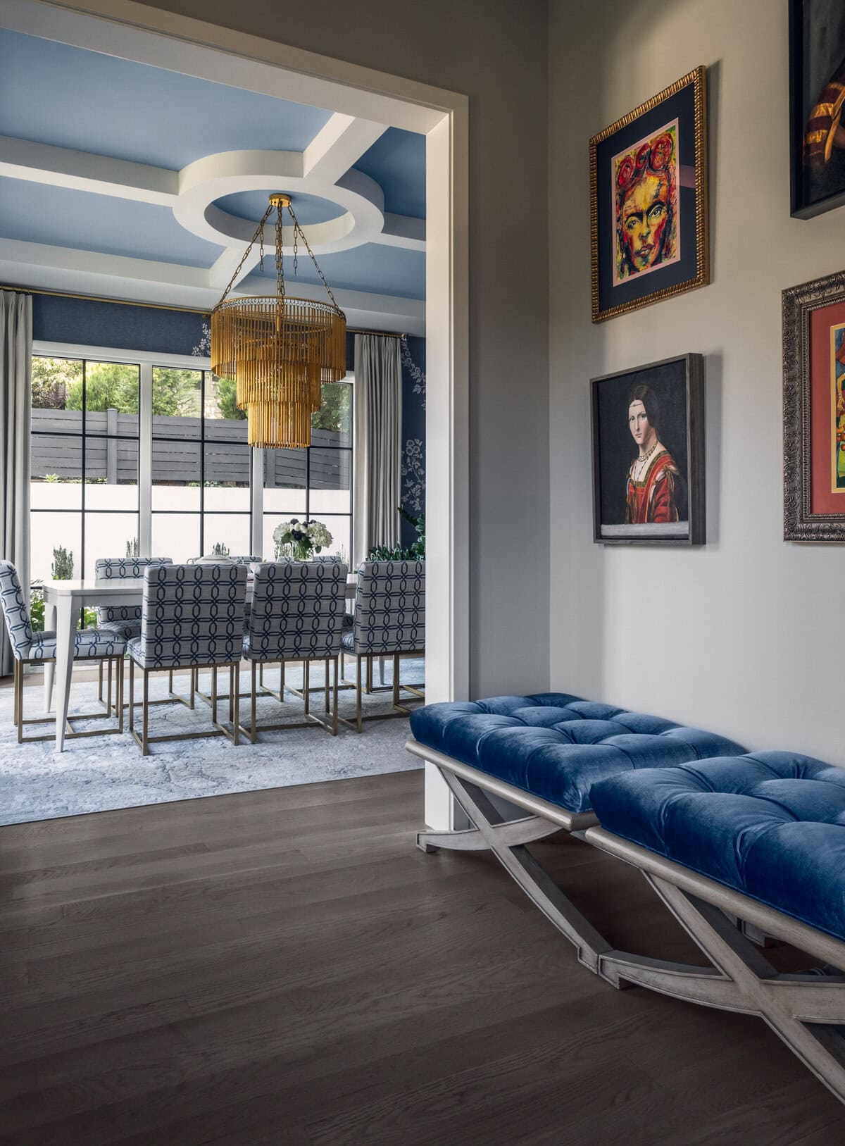 Velvet benches and collected artwork set a welcoming, worldly tone right at the entrance.