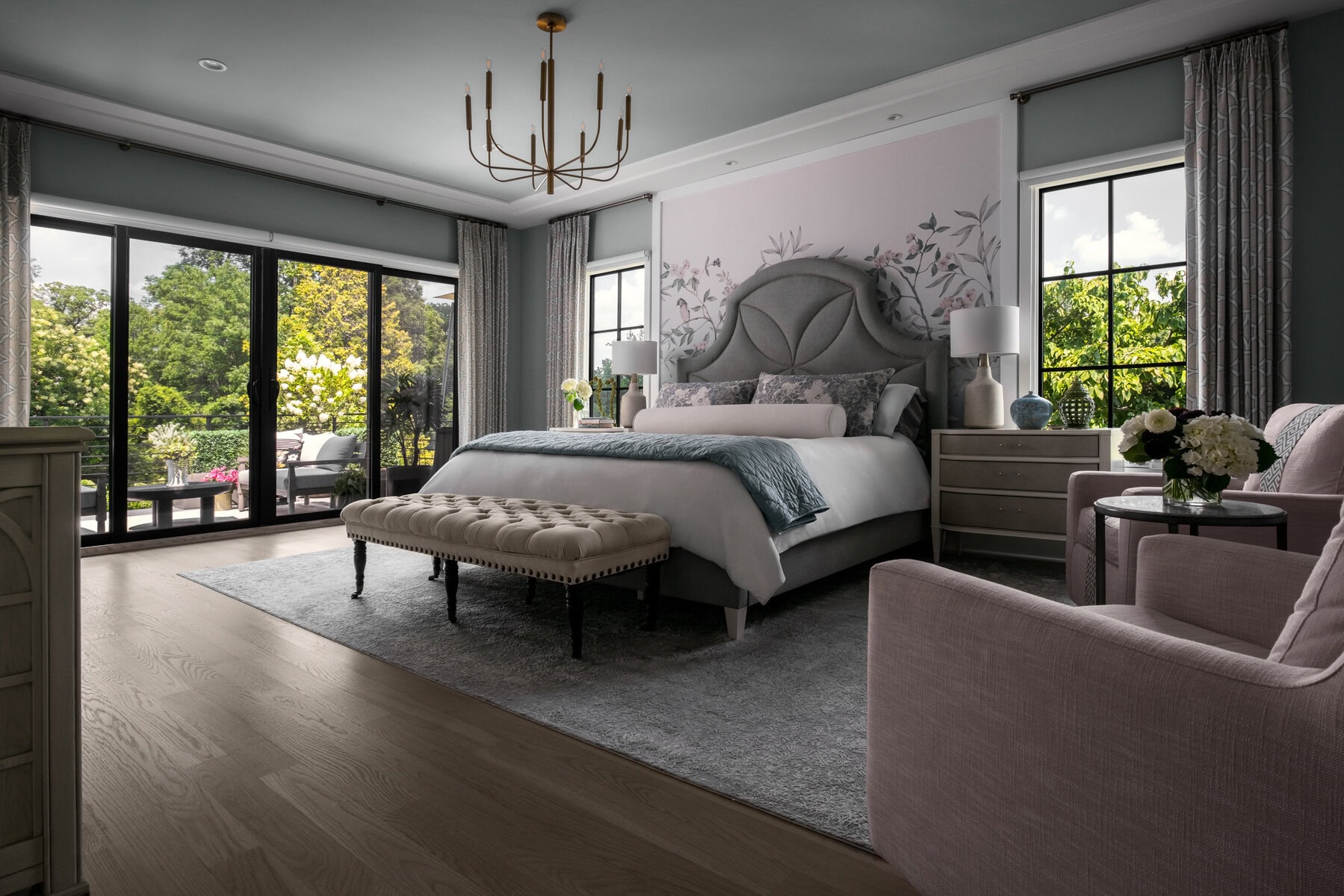 Soft blues, blush tones, and layered bedding create a romantic retreat.